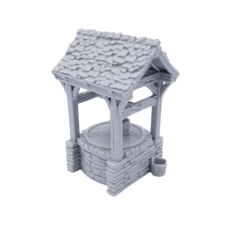 Gray miniature well with a roof on a white background