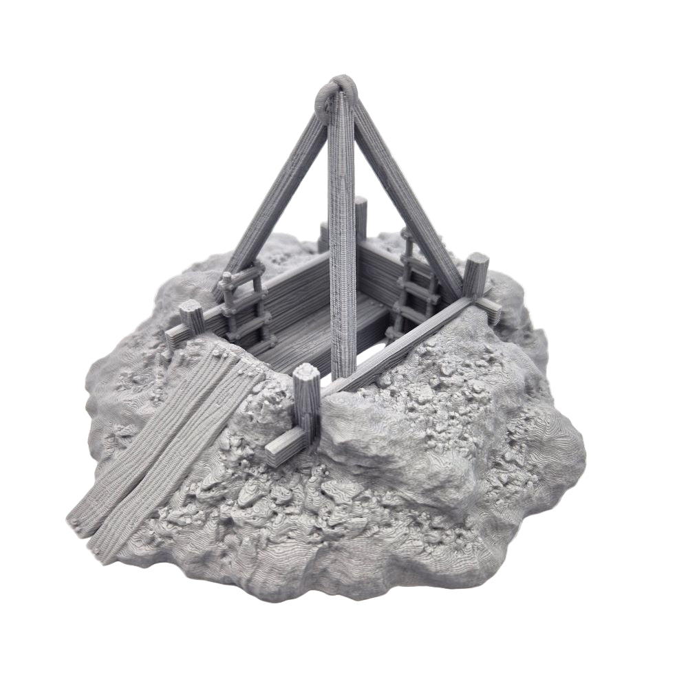 Model of a medieval mine on a rocky base with a white background