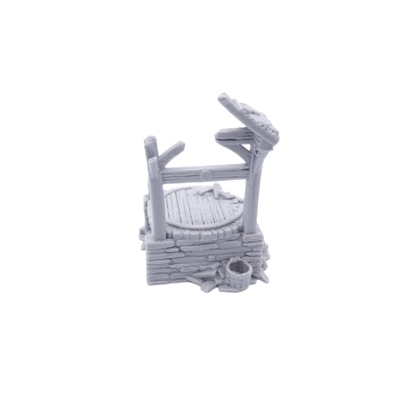 Gray miniature water well on a white background
