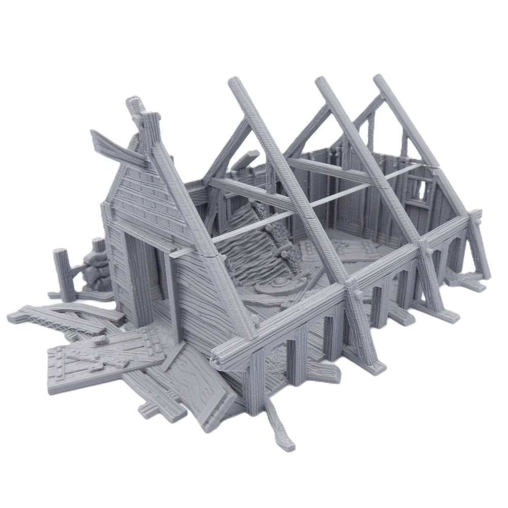 Gray 3D-printed model of a dilapidated building structure on a white background